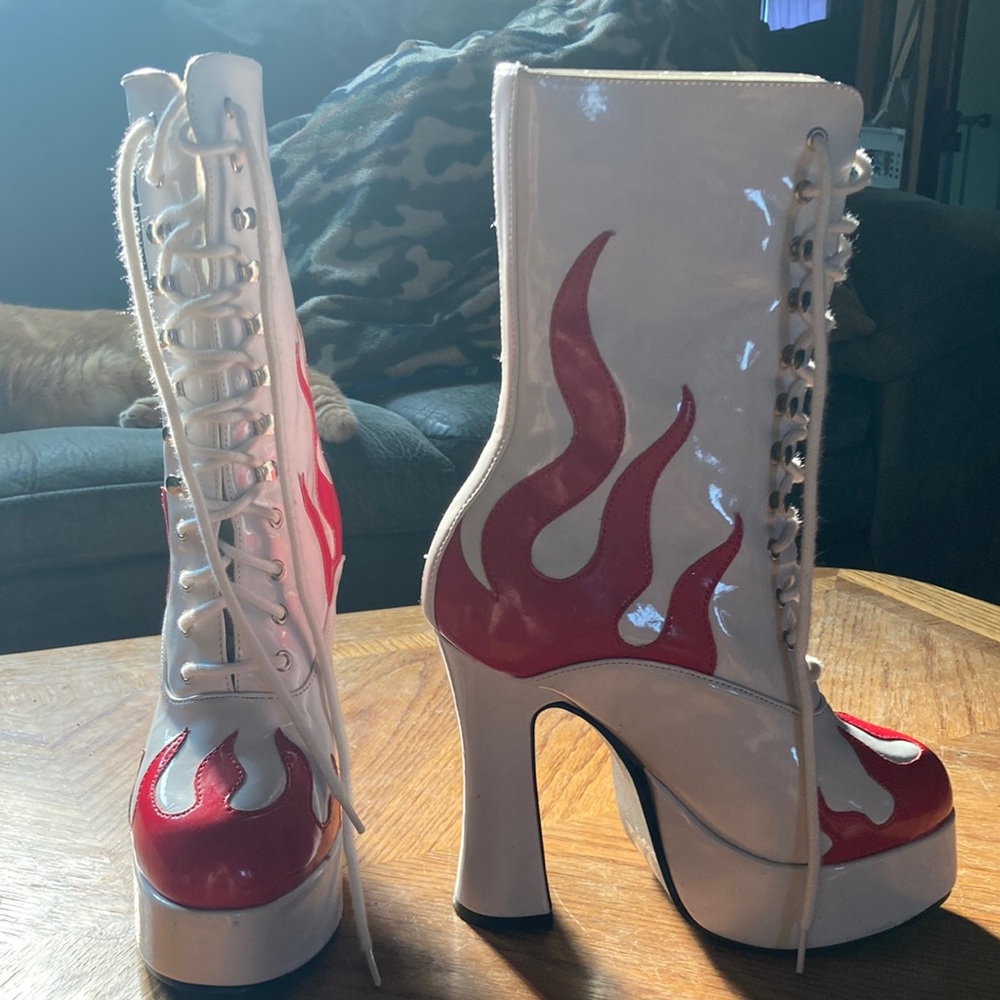 Boots by Ellie. White and red. Size 6. Platform is 1 1/2 in. Heel is 5 in.